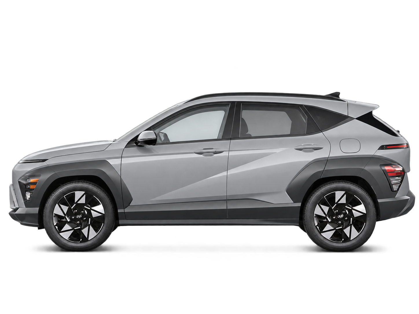 Left-facing side view of a silver-grey 2026 Hyundai Kona Preferred.